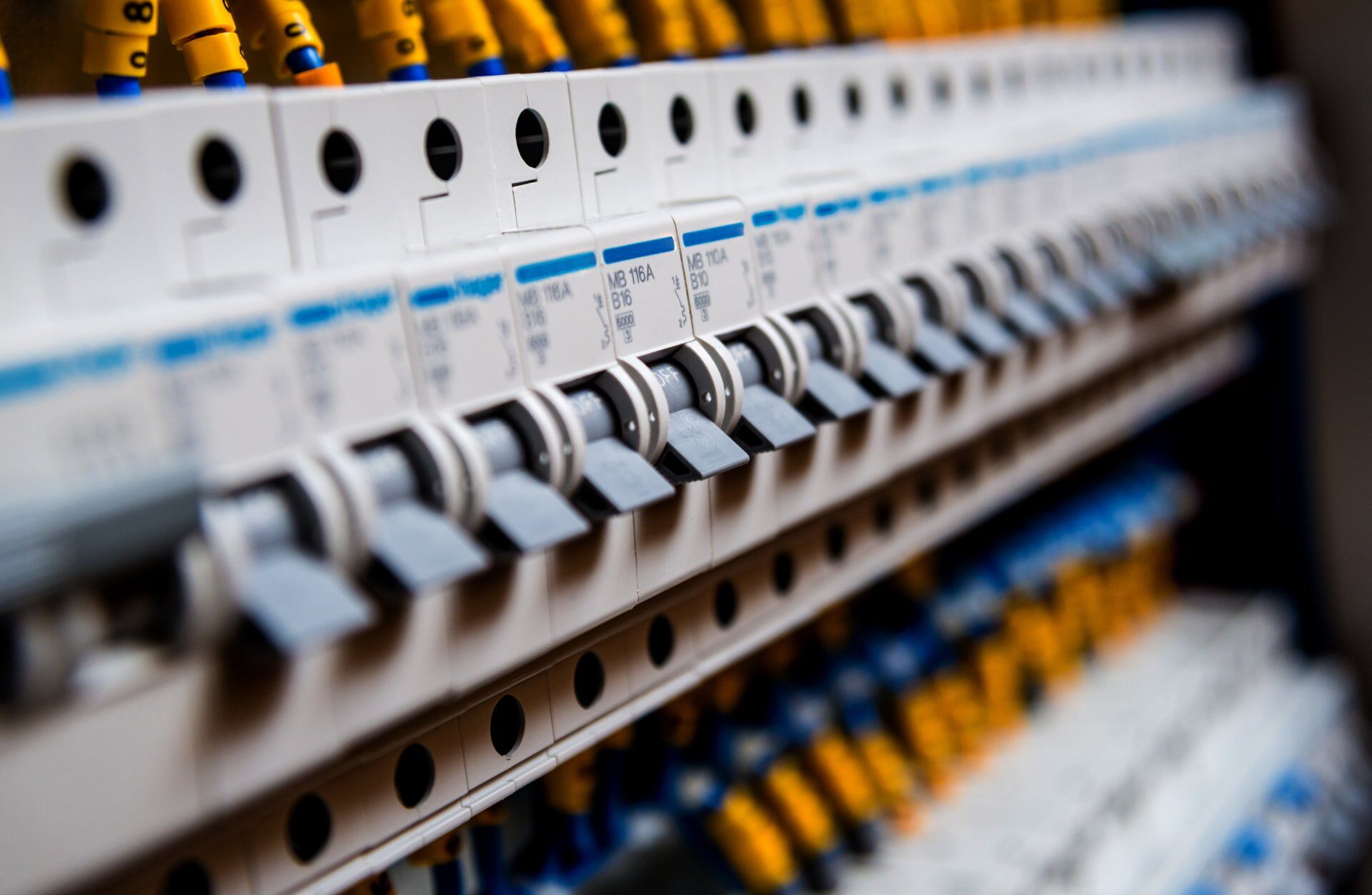 stock-photo-voltage-switchboard-with-circuit-breakers-electrical-background-675267964-1